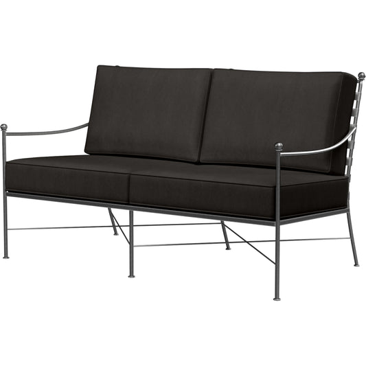 Provence Outdoor Loveseat by Sunset West. Made from wrought iron in a modern style.