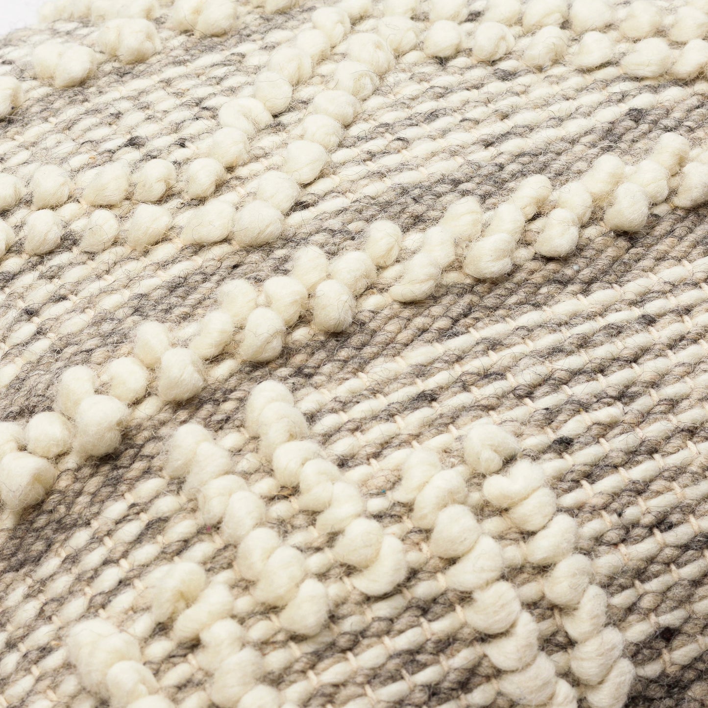 008 S-347982,S-347983,S-347984,S-347985,SI-1850800,SI-1850801,SI-1850802,SI-1850803 | Closeup | Faroe Pillow - 30053 by Livabliss in cream, khaki, black. Made from 70% wool, 30% cotton, 100% cotton in a eclectic & global style.