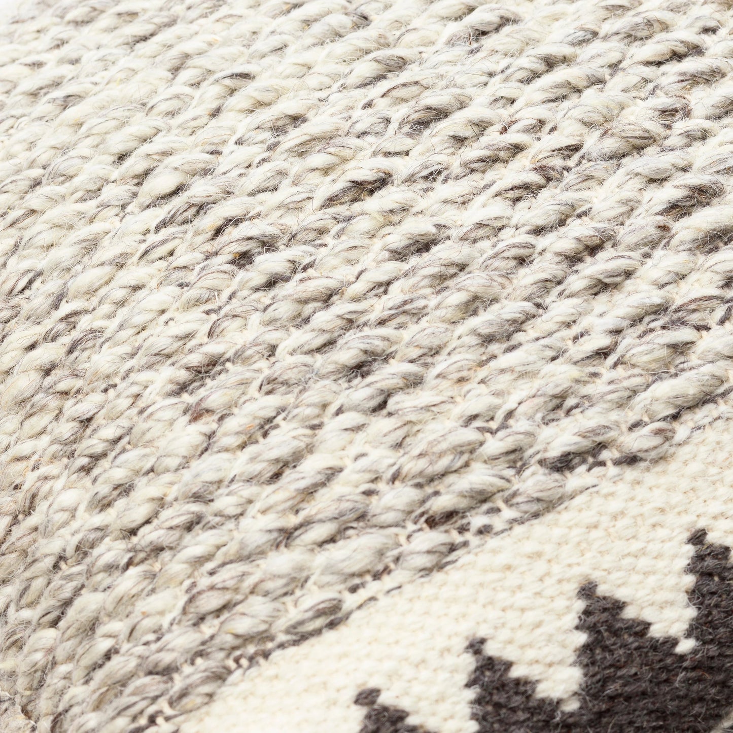 007 S-347986,S-347987,S-347988,S-347989,SI-1850804,SI-1850805,SI-1850806,SI-1850807 | Closeup | Faroe Pillow - 32356 by Livabliss in cream, ivory, dark brown, charcoal. Made from 70% wool, 30% cotton, 100% cotton in a eclectic & global style.