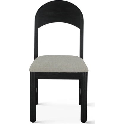 Bakio 18" Upholstered Dining Chair by World Interiors in black and sleek. Made from mango wood in a modern style.
