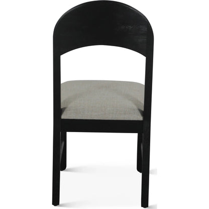 Bakio 18" Upholstered Dining Chair by World Interiors in black and sleek. Made from mango wood in a modern style.