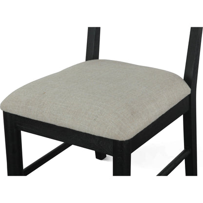 Bakio 18" Upholstered Dining Chair by World Interiors in black and sleek. Made from mango wood in a modern style.