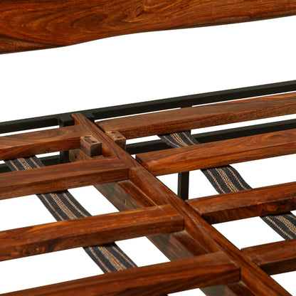 Elliston Reclaimed Wood Bed by World Interiors in brown, black and natural sheesham. Made from reclaimed iron sheesham wood in a transitional style.