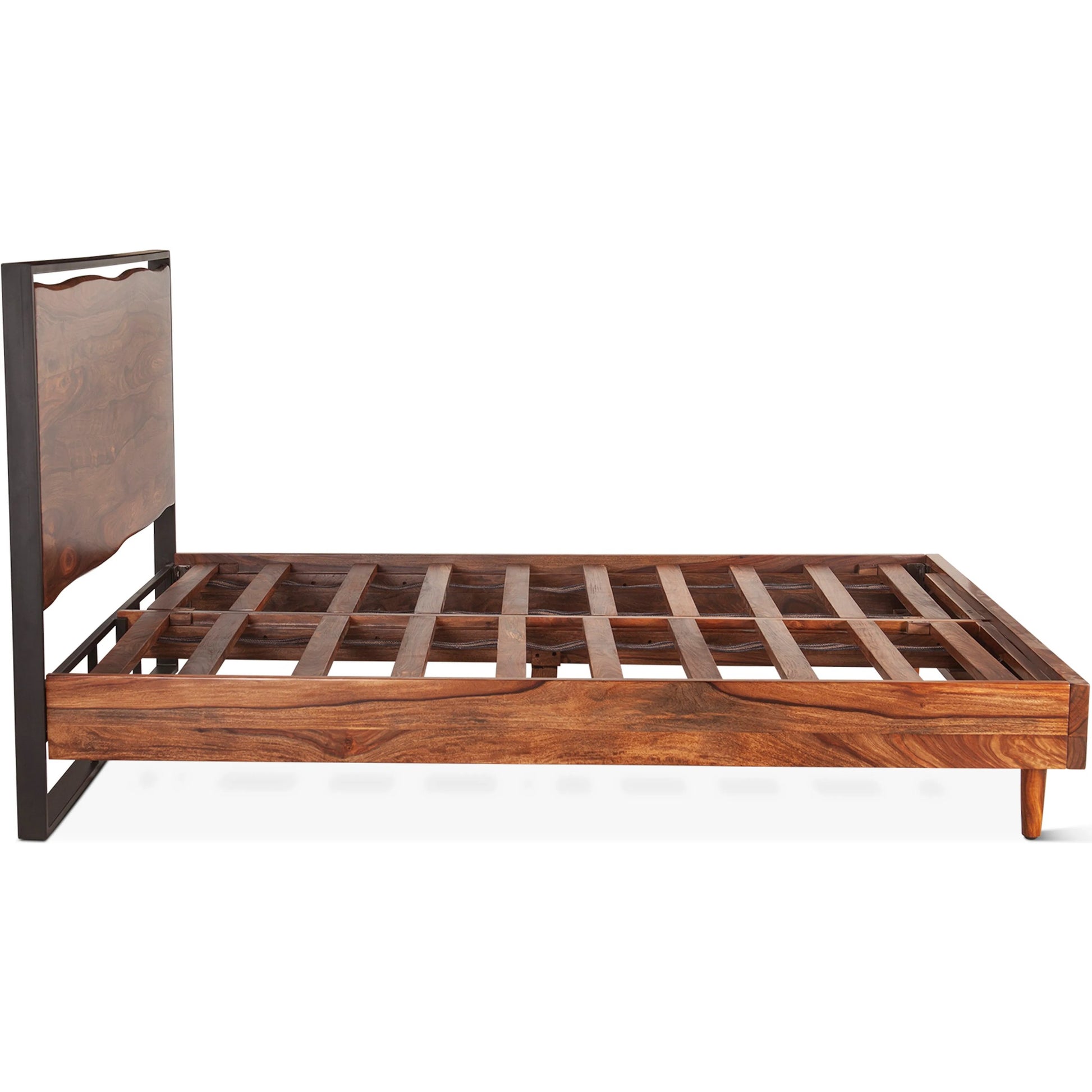 Elliston Reclaimed Wood Bed by World Interiors in brown, black and natural sheesham. Made from reclaimed iron sheesham wood in a transitional style.