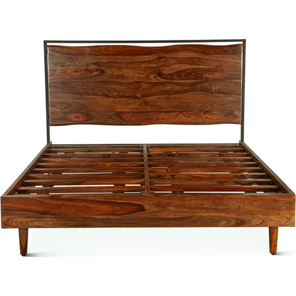 Elliston Reclaimed Wood Bed by World Interiors in brown, black and natural sheesham. Made from reclaimed iron sheesham wood in a transitional style.