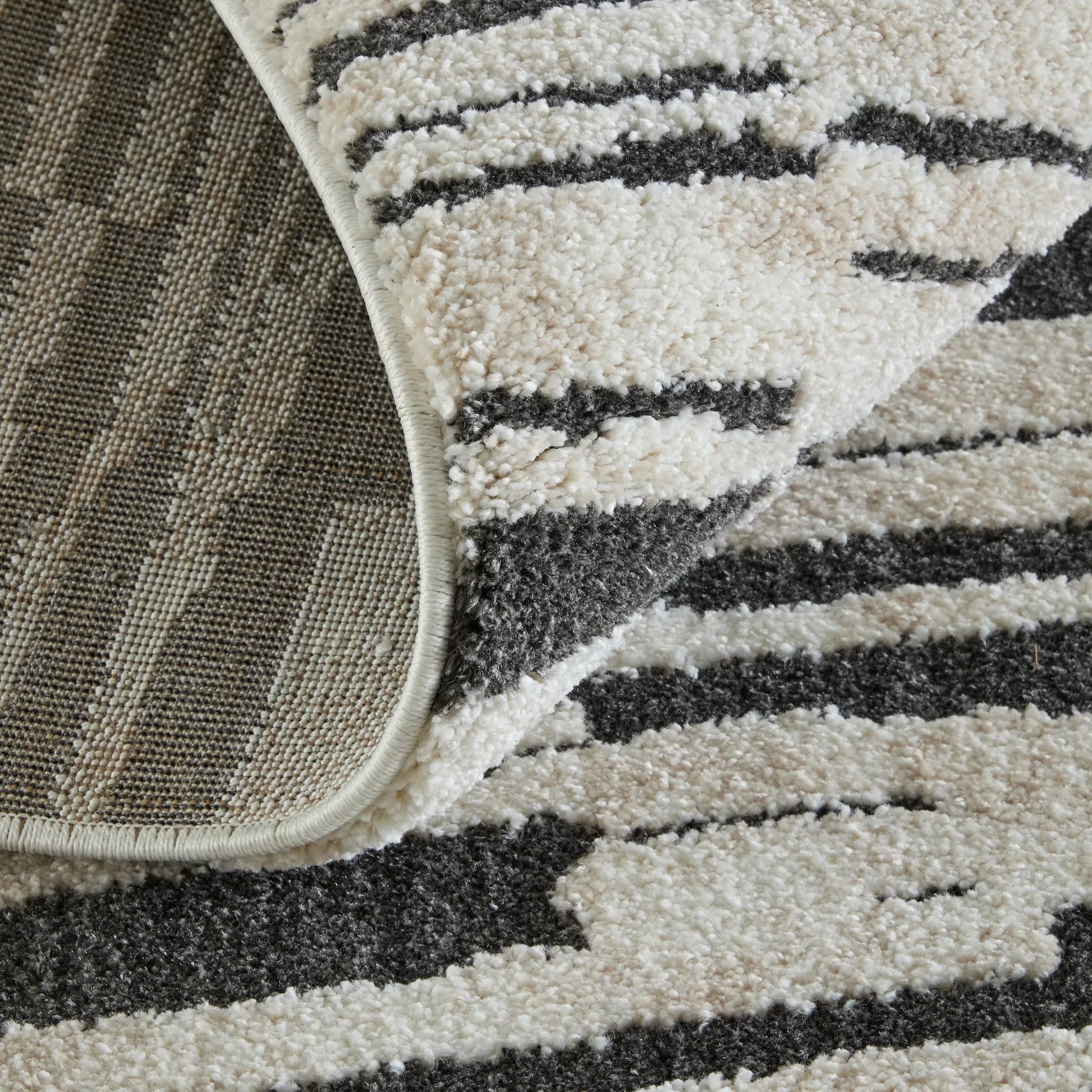 Gilmore Stripes GIL39UPF Rug by Feizy in ivory, black. Made from polypropylene in a unique style.