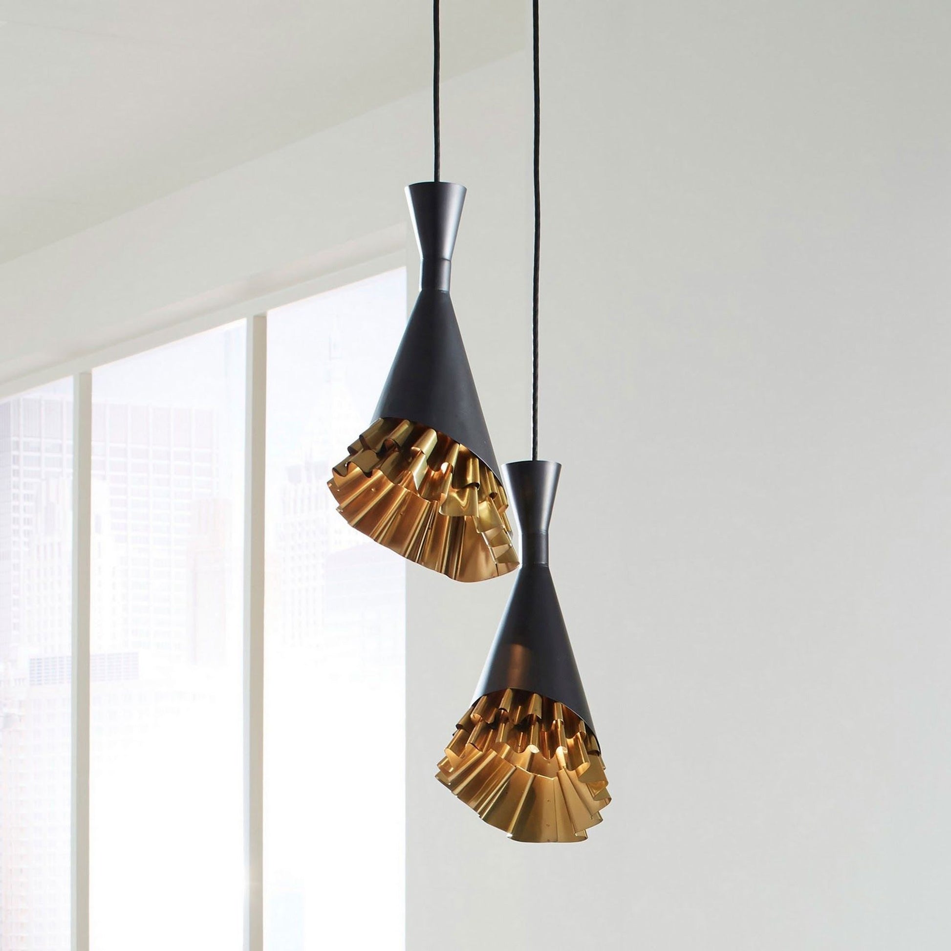 Ruffle Pendant Lamp by Phillips Collection in black, gold and brass. Made from metal in a eclectic & global style.