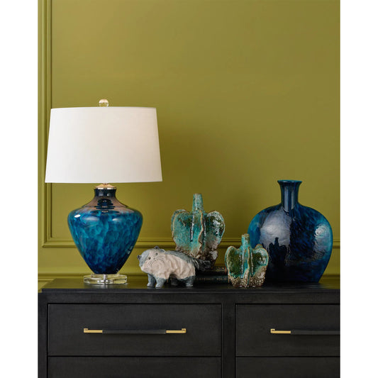 Pavonini Vase by Currey and Company in blue. Made from glass in a unique style.