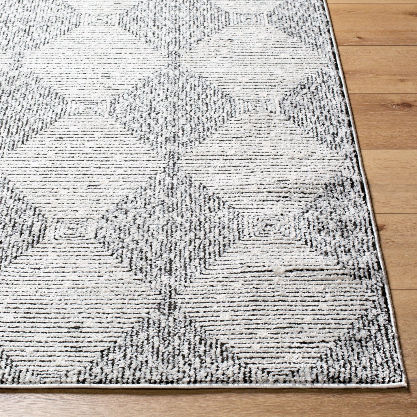 002 SI-2167747,SI-2167750 | Closeup | Freud FEU-2332 Rug by Livabliss in ivory, black. Made from polyester in a unique style.