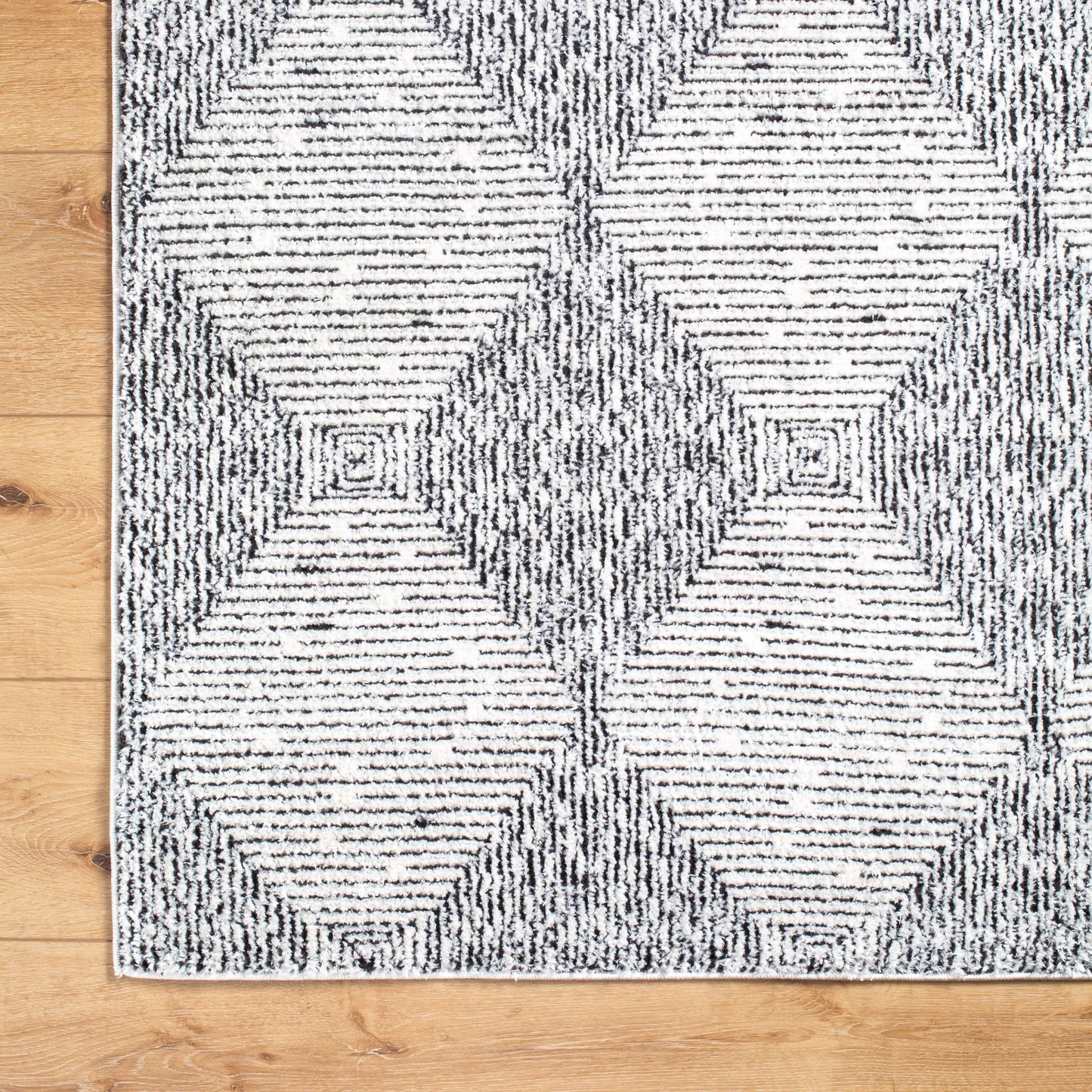 005 SI-2167747,SI-2167750 | Closeup | Freud FEU-2332 Rug by Livabliss in ivory, black. Made from polyester in a unique style.