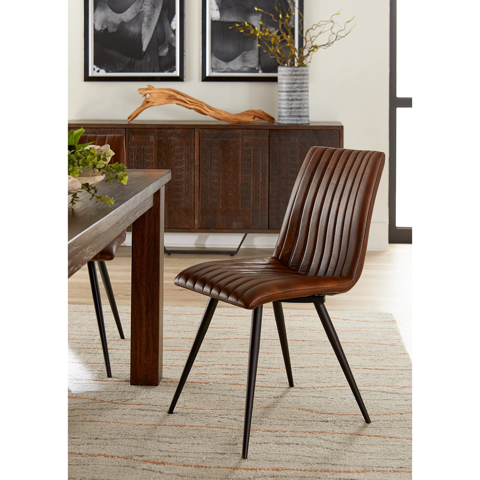 Brisben Vintage Modern Hand Washed Leather Dining Chair by World Interiors. Made from leather, iron in a modern style.