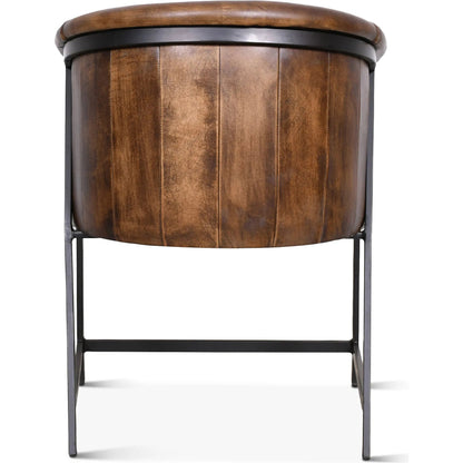 Brisbane Armchair by World Interiors in browns and whiskey. Made from reclaimed iron top, top grain leather in a traditional style.