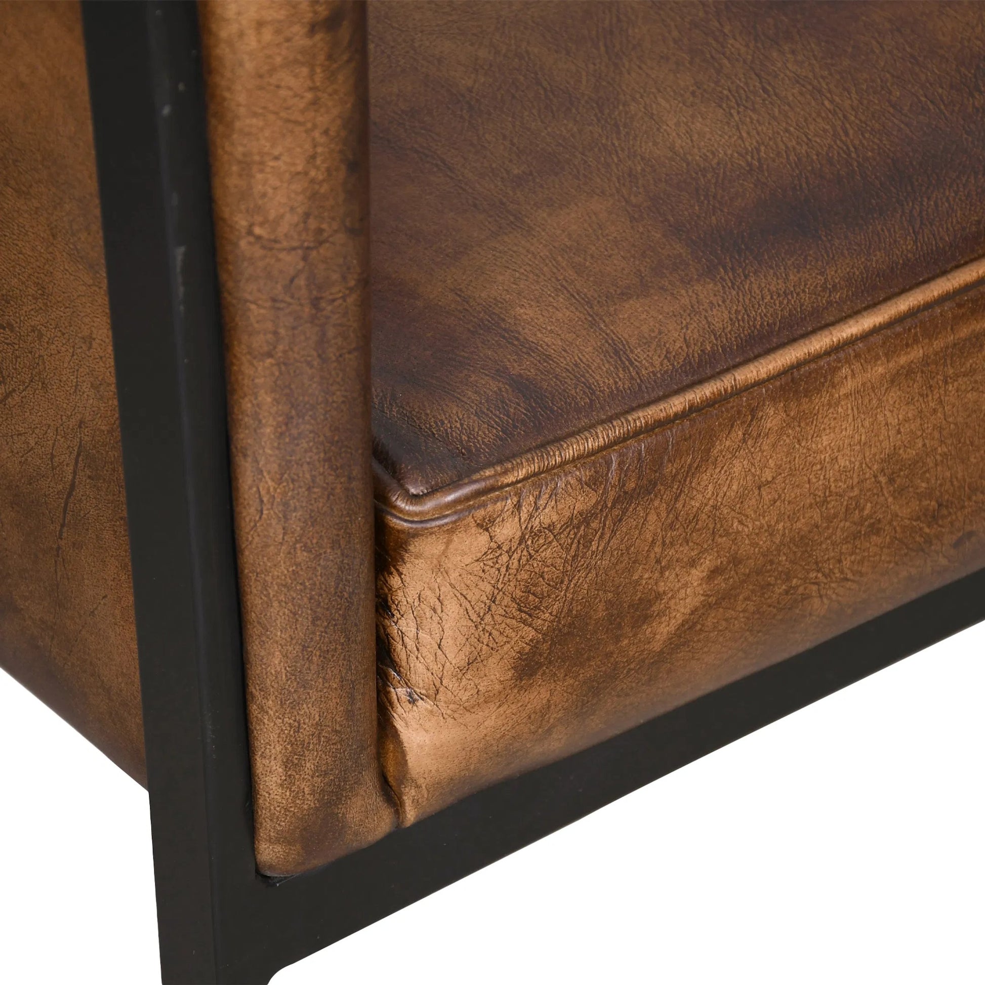 Brisbane Armchair by World Interiors in browns and whiskey. Made from reclaimed iron top, top grain leather in a traditional style.