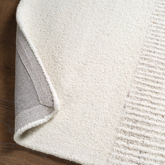 Finnigan FGN05 Rug by Jaipur Living in tan, beige, ivory, white. Made from 100% wool in a unique style.