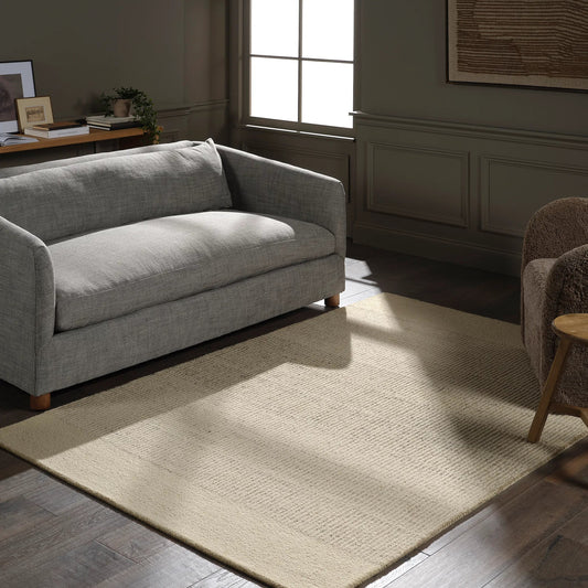 Finnigan FGN05 Rug by Jaipur Living in tan, beige, ivory, white. Made from 100% wool in a unique style.