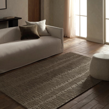 Finnigan FGN08 Rug by Jaipur Living in taupe. Made from 100% wool in a unique style.