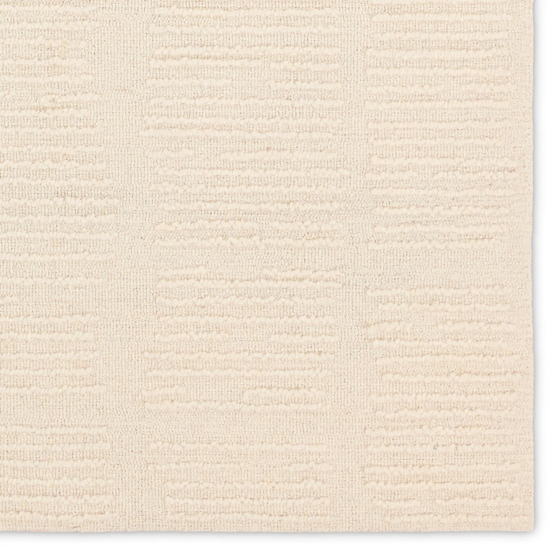 Finnigan FGN09 Rug by Jaipur Living in sand, cream. Made from 100% wool in a unique style.