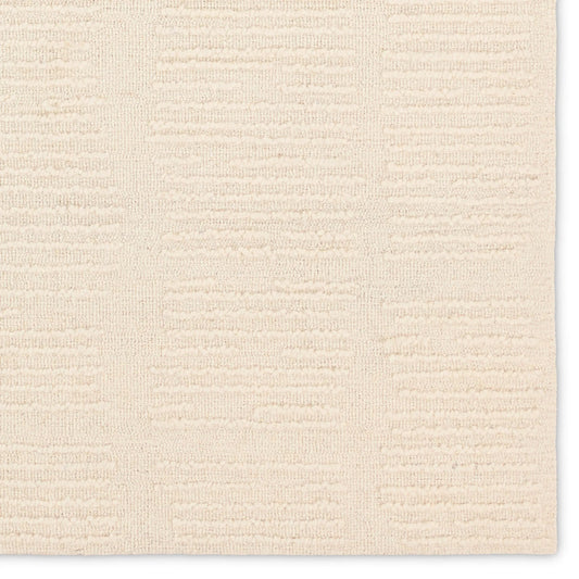 Finnigan FGN09 Rug by Jaipur Living in sand, cream. Made from 100% wool in a unique style.