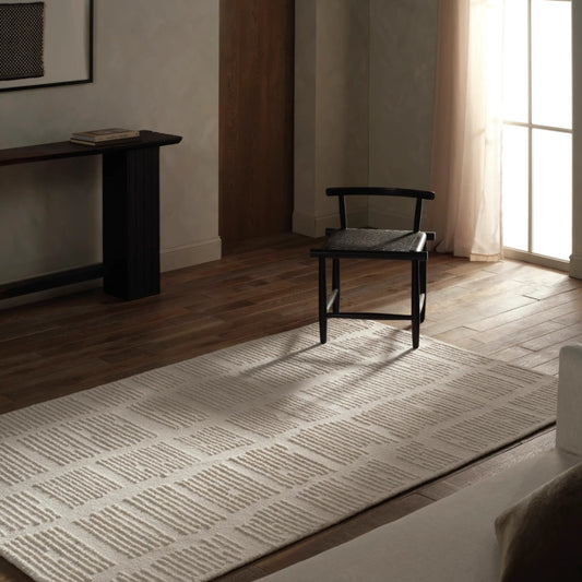 Finnigan FGN09 Rug by Jaipur Living in sand, cream. Made from 100% wool in a unique style.