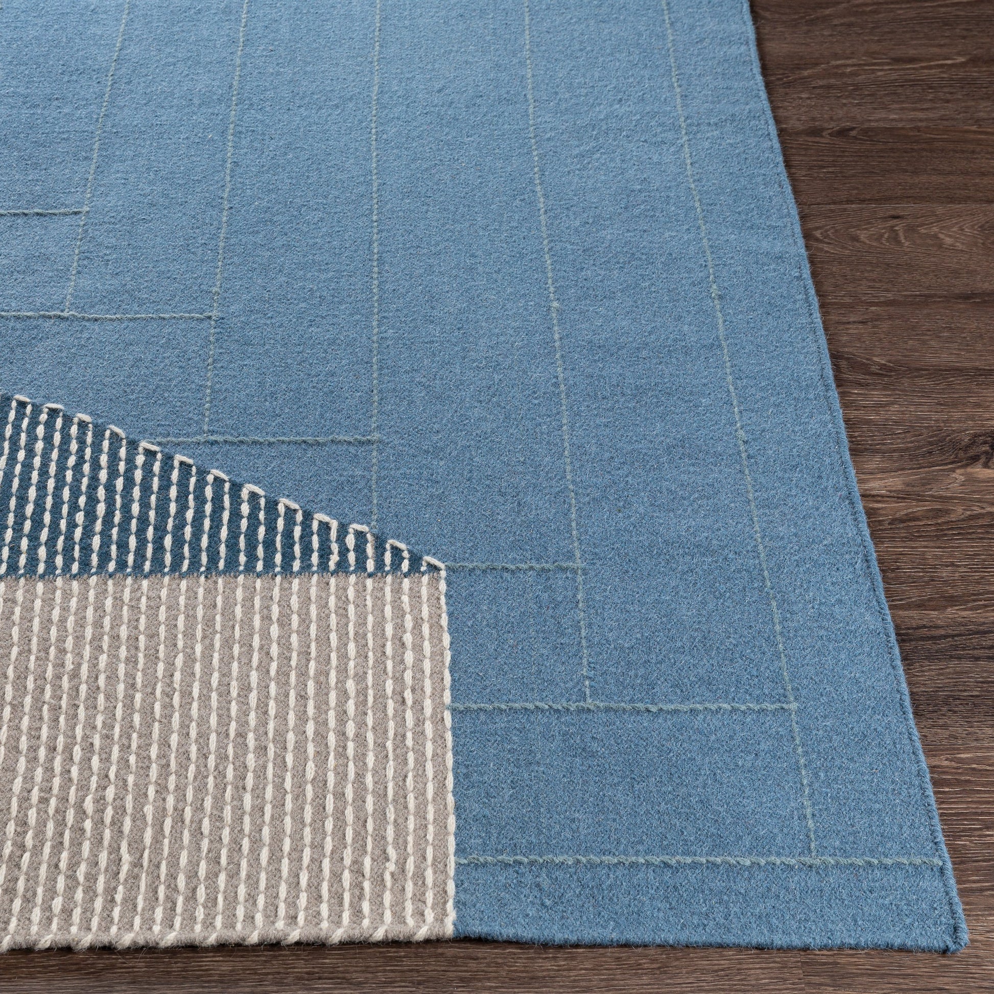 Fulham Rug - 26507 by Livabliss in blue, medium gray, off-white, taupe, dark blue. Made from 80% wool, 20% cotton in a unique style.