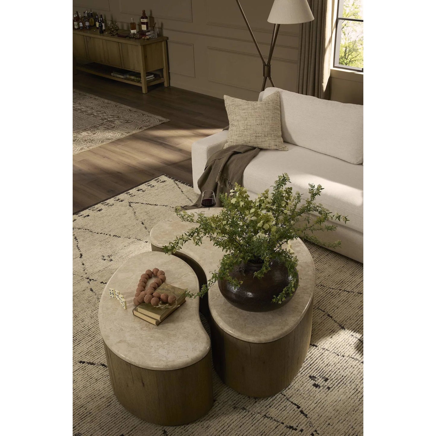 013 SI-2519199 | Lifestyle | Ingrid Coffee Table by Four Hands in cappuccino marble, drifted oak veneer. Made from solid marble, thick oak veneer, solid oak in a transitional style.