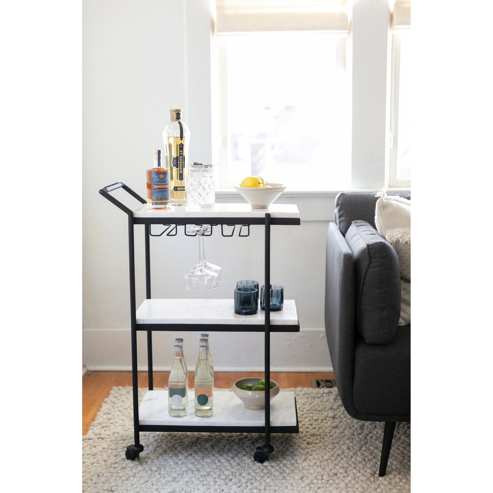After Hours Bar Cart by Moe's Home Collection in textured black. Made from white marble, iron frame in a modern style.
