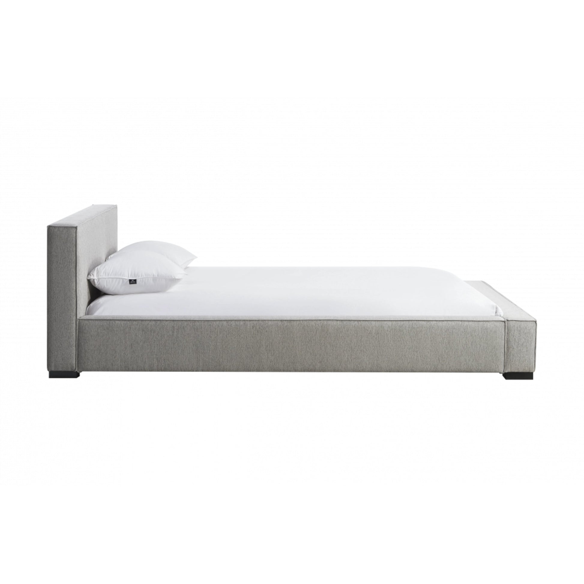 Zest Wide Upholstered Bed by Zest. Made from rubberwood, fabric in a modern style.