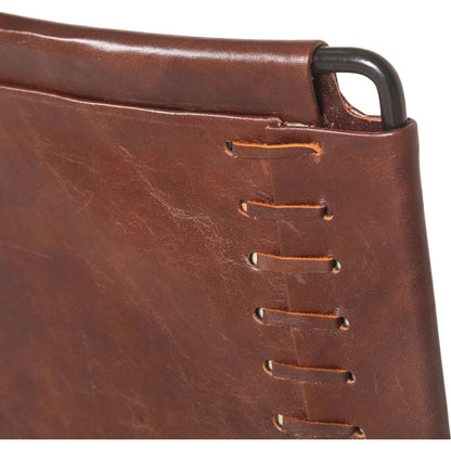 Melbourne Dining Armchair by World Interiors in dark brown and black. Made from reclaimed iron, leather in a modern style.