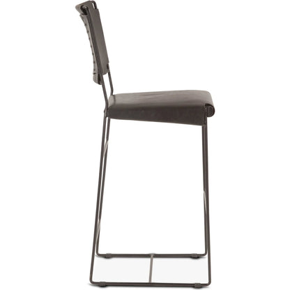 Melbourne Buffalo Gray Counter Chair by World Interiors in gray and powder coated black. Made from reclaimed iron top, top grain leather in a traditional style.