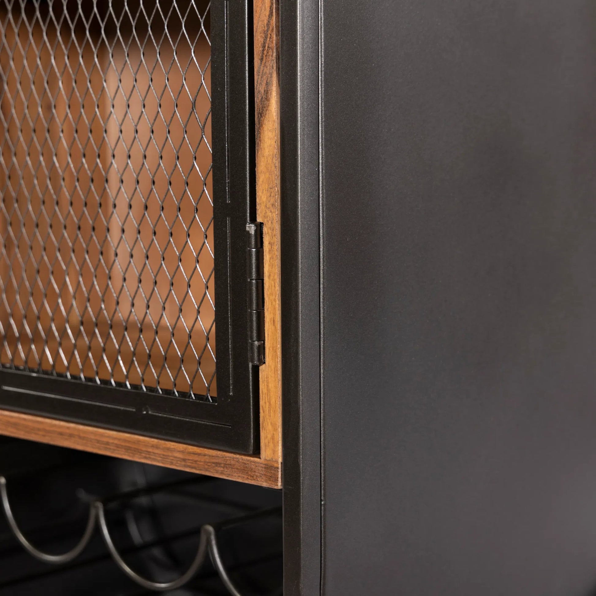 Mescalero Bar Cabinet by World Interiors in black and powder coated black. Made from mango wood reclaimed iron in a modern style.