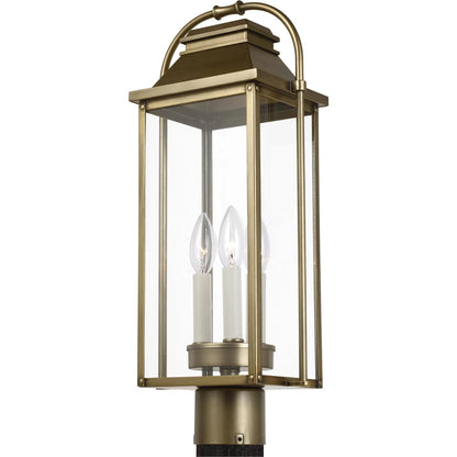 Wellsworth Post Lantern by Generation Lighting in painted distressed brass. Made from cast aluminum in a rustic style.