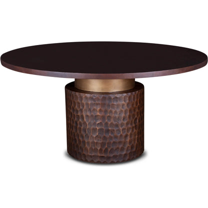 Vallarta Carved Wood Round Dining Table by World Interiors in bronze, gold and two toned bronze. Made from mango wood, cast aluminum in a eclectic & global style.
