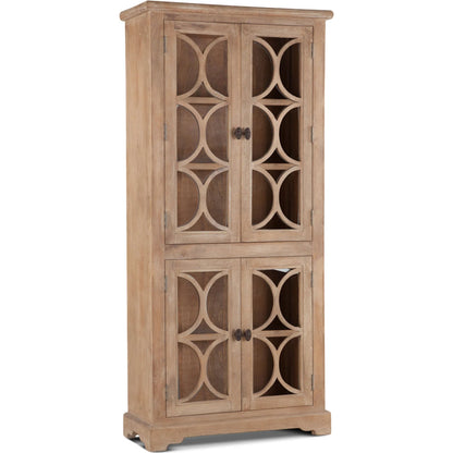 Pengrove Tall Cabinet by World Interiors in light brown and antique oak. Made from mango wood, glass in a transitional style.