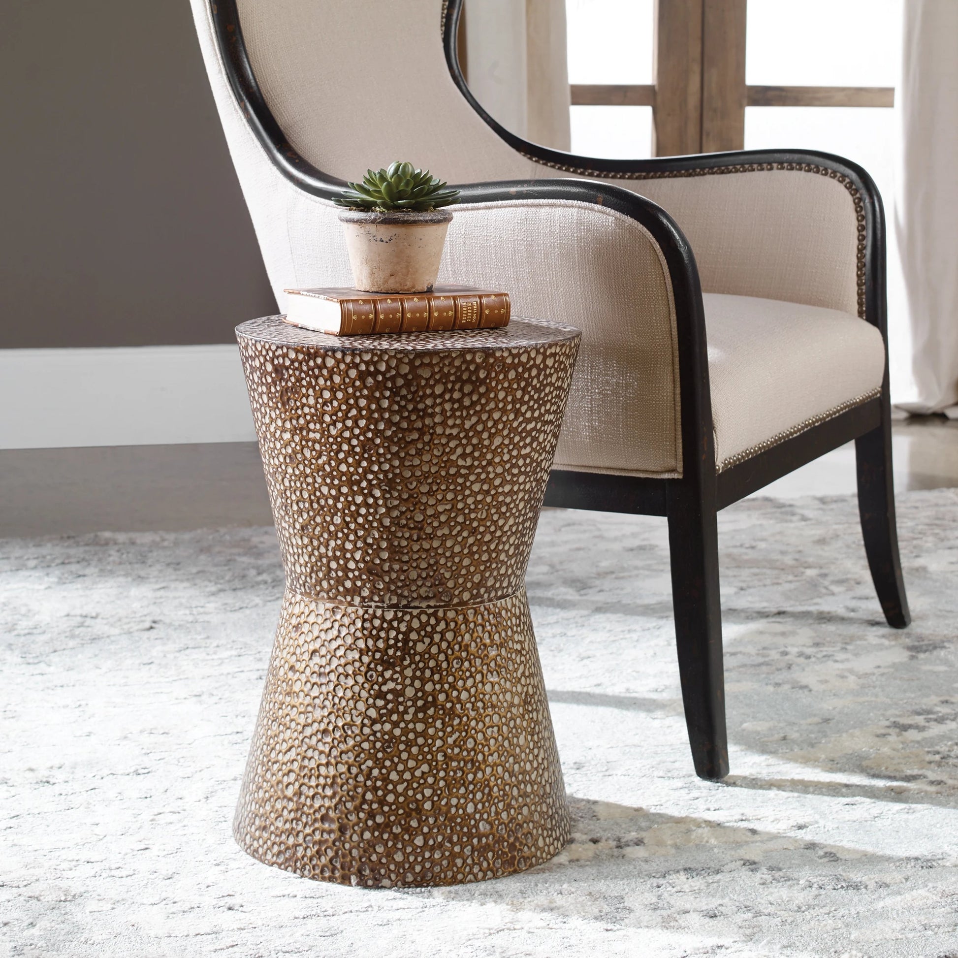 Cutler Drum Shaped Accent Table by Uttermost. Made from iron in a modern style.