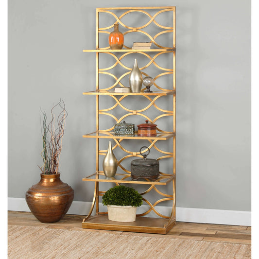 Lashaya Etagere by Uttermost in gold. Made from metal, tempered glass in a modern style.