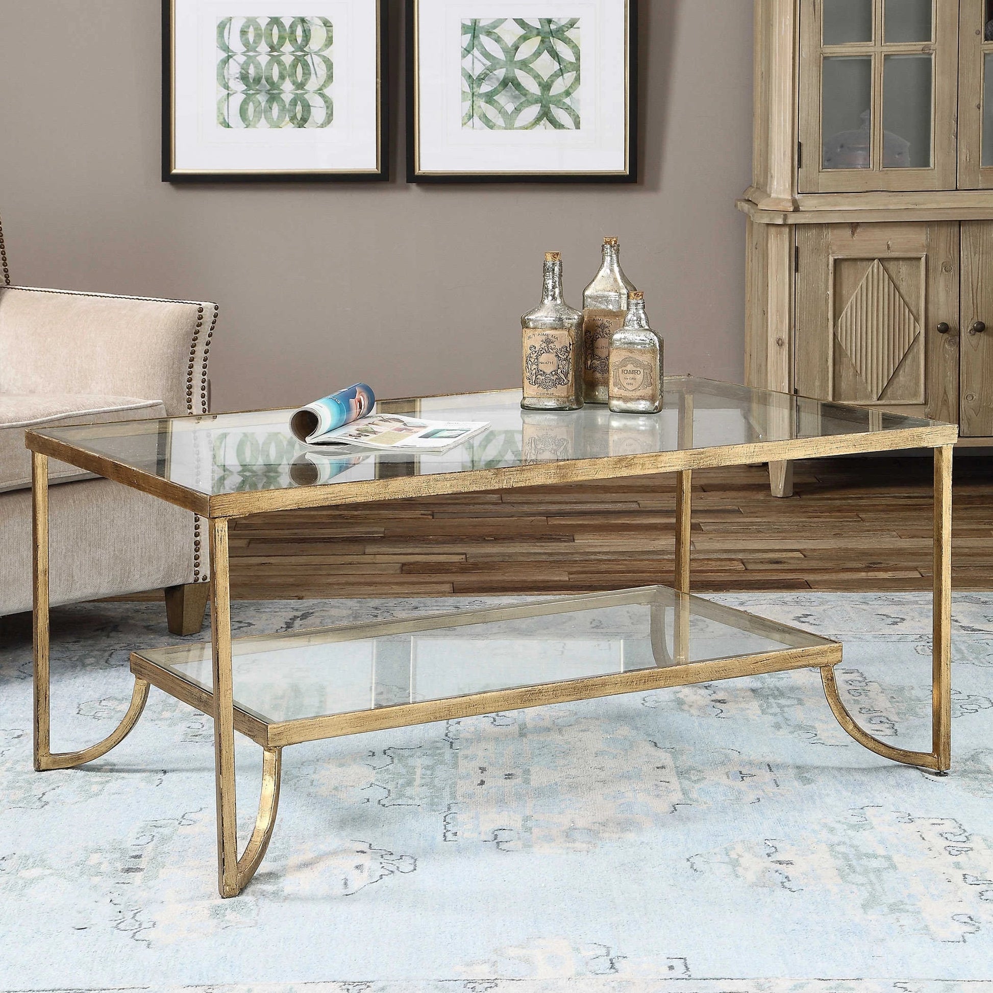 Katina Coffee Table by Uttermost in gold. Made from metal, glass in a modern style.