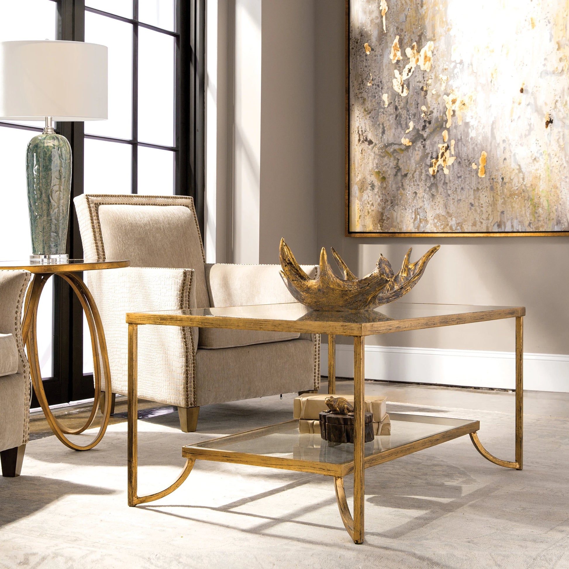 Katina Coffee Table by Uttermost in gold. Made from metal, glass in a modern style.