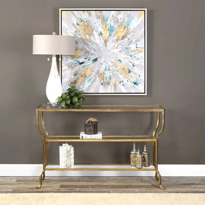 Deline Console Table by Uttermost in gold. Made from iron, glass in a modern style.
