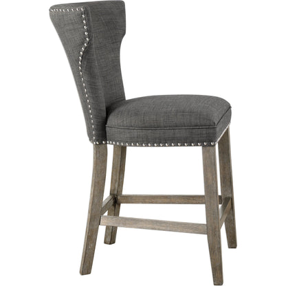 Arnaud Charcoal Counter Stool by Uttermost in charcoal. Made from solid wood, plywood, fabric, foam in a cottage & farmhouse style.