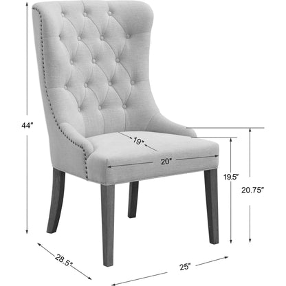 Rioni Tufted Wing Chair by Uttermost. Made from fabric, oak wood, plywood, foam in a traditional style.
