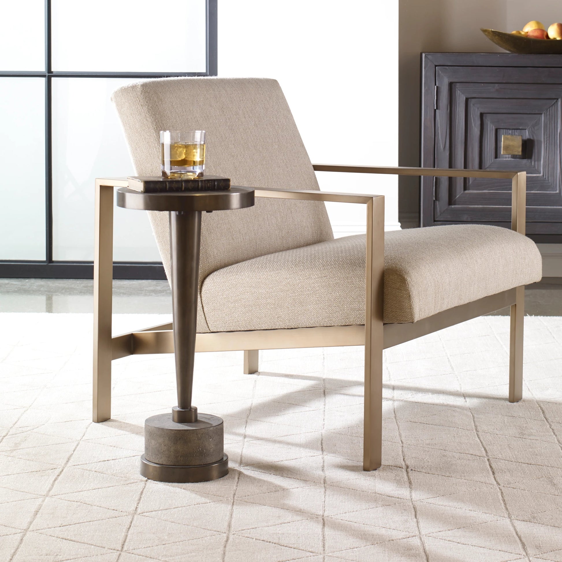 Masika Accent Table by Uttermost in bronze. Made from concrete, metal in a modern style.