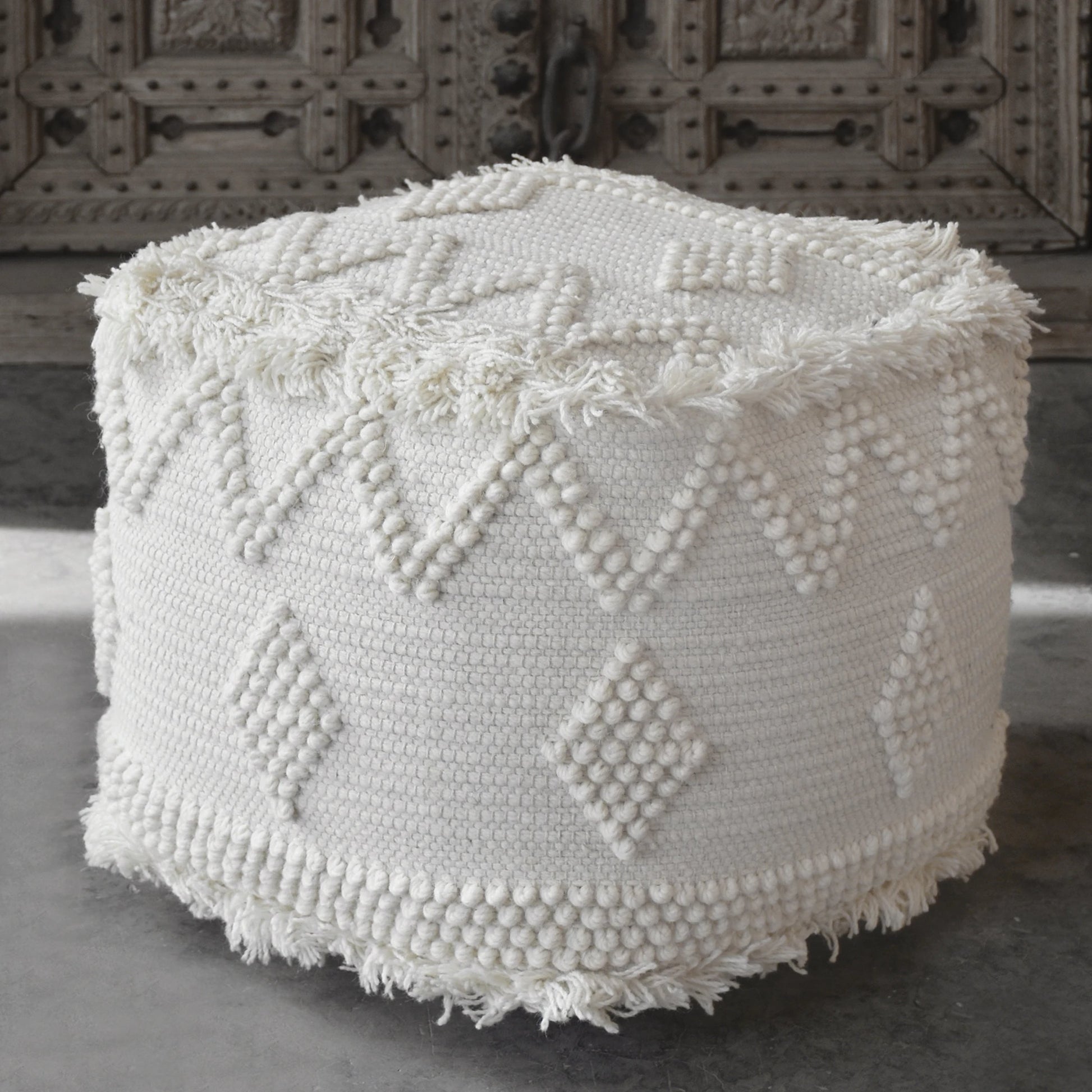 Uriah Ivory Pouf by Uttermost. Made from wool, cotton in a eclectic & global style.