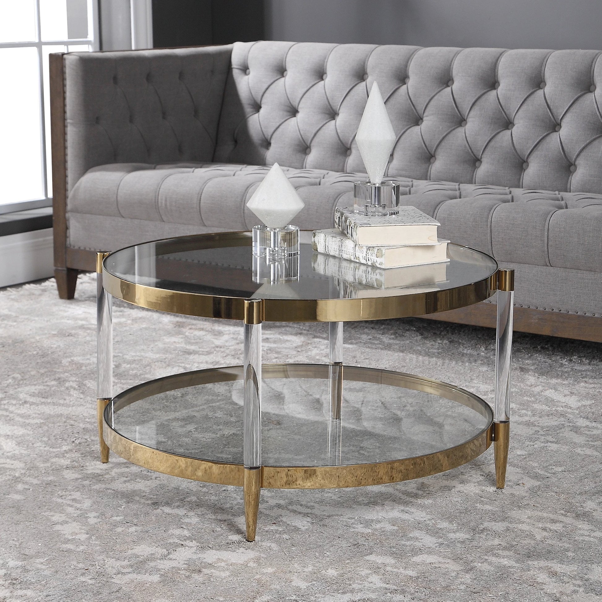Kellen Coffee Table by Uttermost in gold. Made from stainless steel, glass, acrylic in a transitional style.