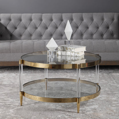 Kellen Coffee Table by Uttermost in gold. Made from stainless steel, glass, acrylic in a transitional style.