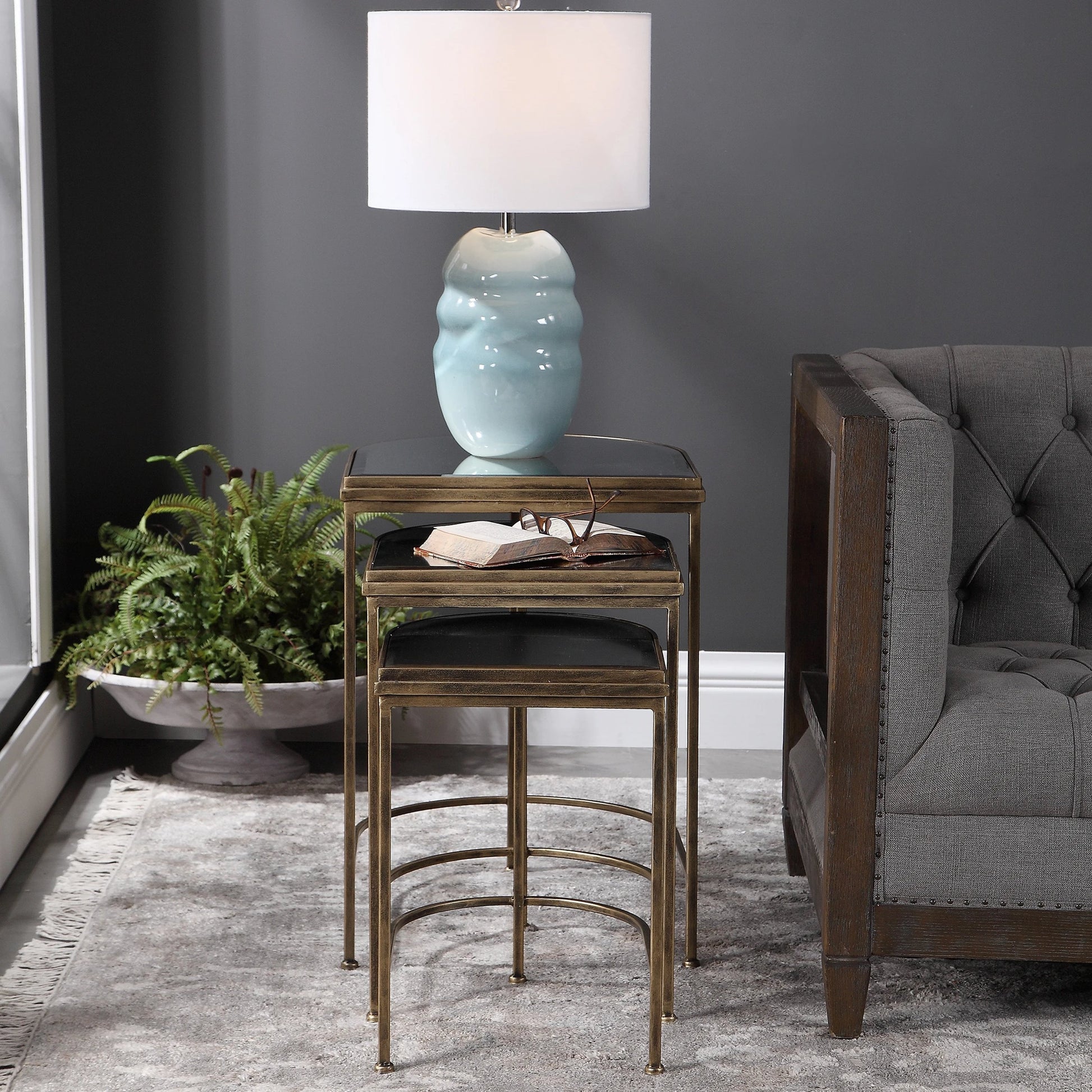 India Nesting Tables by Uttermost in antique brushed gold. Made from mirror 45%, iron 55% in a transitional style.