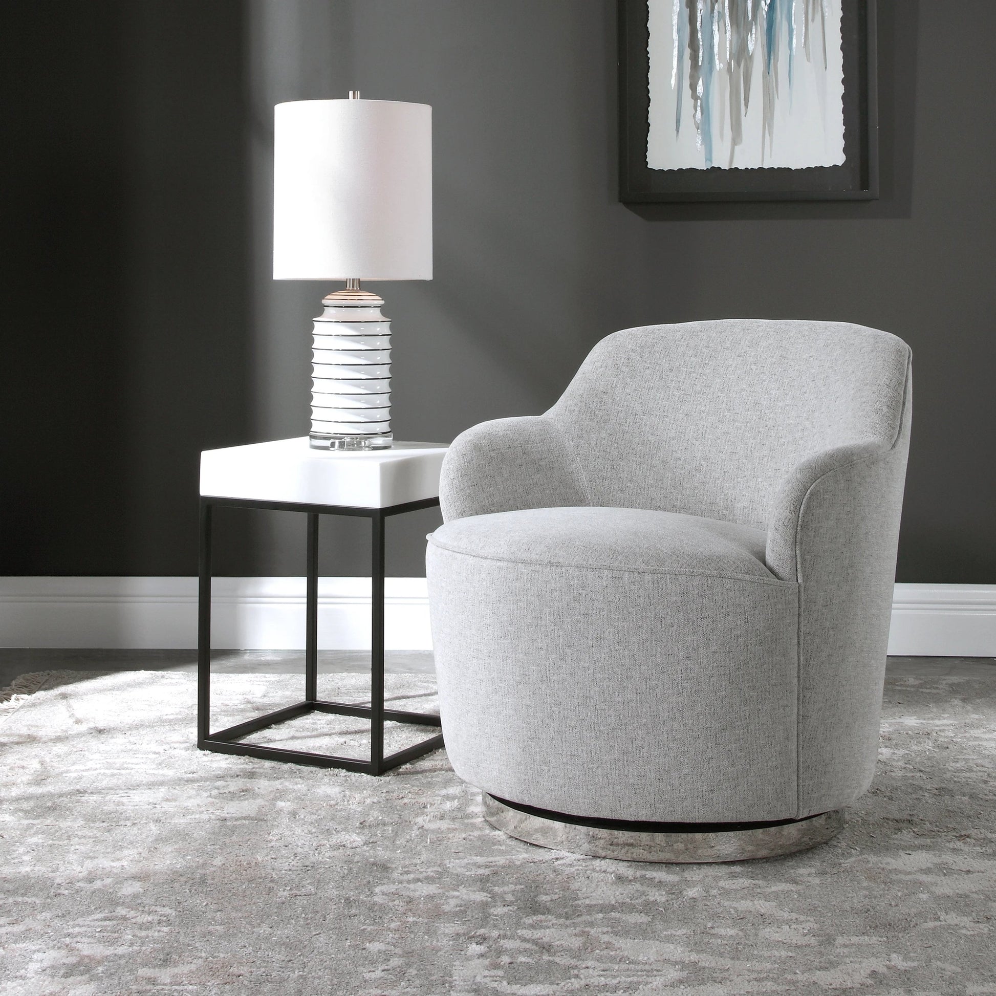 Hobart Casual Swivel Chair by Uttermost. Made from plywood, stainless steel, fabric, foam in a modern style.