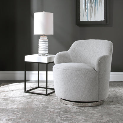 Hobart Casual Swivel Chair by Uttermost. Made from plywood, stainless steel, fabric, foam in a modern style.
