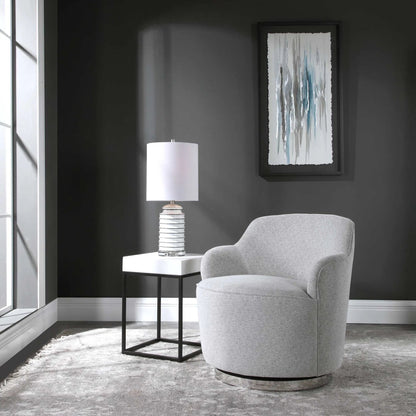 Hobart Casual Swivel Chair by Uttermost. Made from plywood, stainless steel, fabric, foam in a modern style.