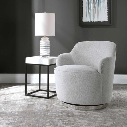 Hobart Casual Swivel Chair by Uttermost. Made from plywood, stainless steel, fabric, foam in a modern style.