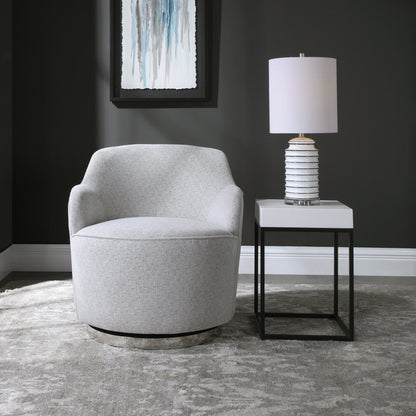 Hobart Casual Swivel Chair by Uttermost. Made from plywood, stainless steel, fabric, foam in a modern style.